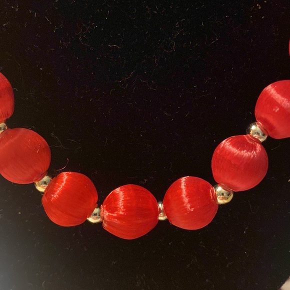 Red fabric covered beaded necklace. Tiny silver beads between the red. - Picture 2 of 3